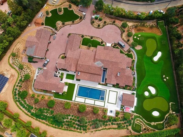 The aerial view of house and golf area at Phoenix, AZ