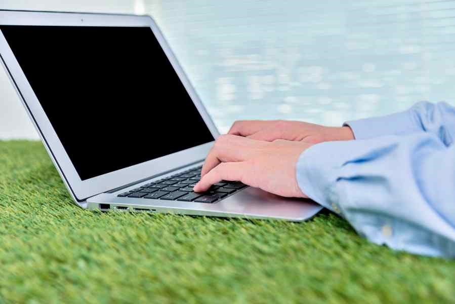 Using a laptop on a artificial grass